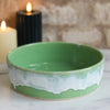 Large ceramic dish from Glosters in pea green glaze