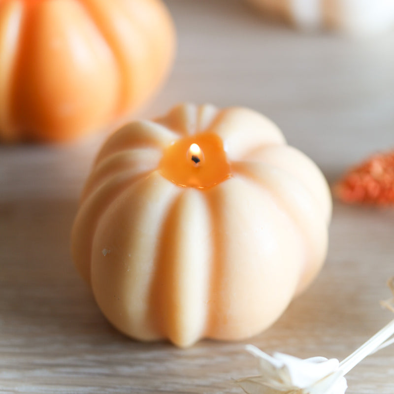 Pumpkin spice candle shaped like a pumpkin