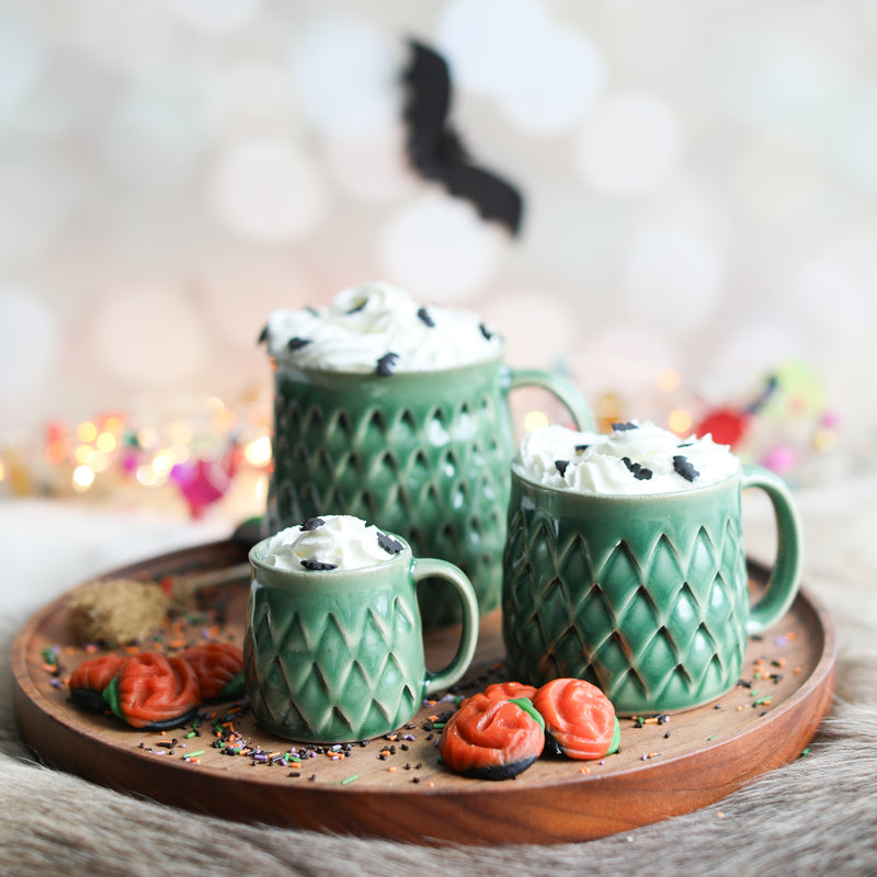 A green dinosaur mug in three sizes from Glosters.