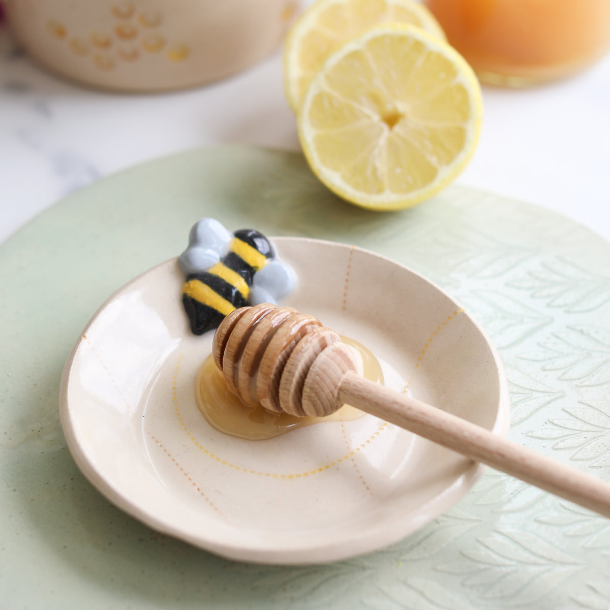 honey dipper on one of the  glosters bee plates.