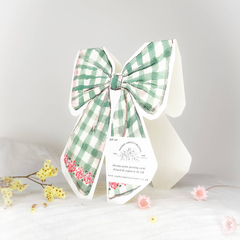 Season's Greetings bow shaped Christmas card