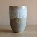 A colourful handmade stoneware drinks beaker from Glosters