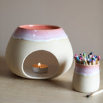 A wax melt burner made from ceramic by Glosters.
