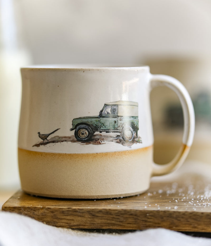 A handmade mug with an illustration of a 4x4 from Glosters.
