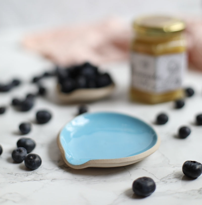 A handmade ceramic spoon rest from the Glosters pottery tableware collection.