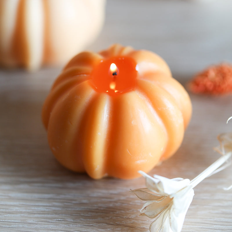 Pumpkin spice candle shaped like a pumpkin